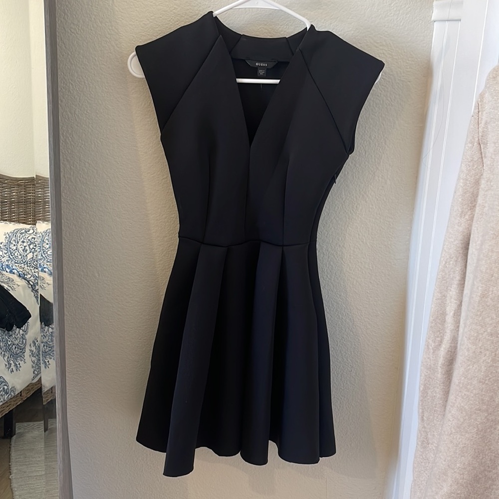Guess scuba dress form fitting on top and skirted on bottom. Mini but not too